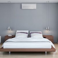 Wall mounted air conditioning in a stylish bedroom