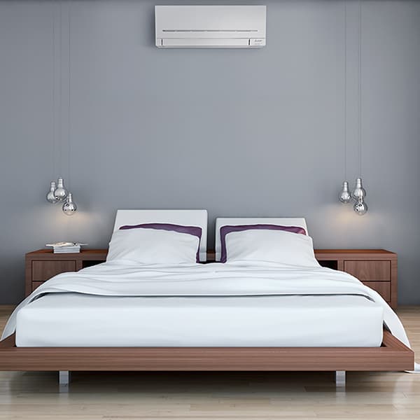 Wall mounted air conditioning in a stylish bedroom