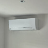 Mitsubishi air conditioning wall unit installed in a bedroom in Marple, Stockport
